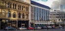 Cook Allan Gibson former offices in the centre, with the Scenic Circle Southern Cross Hotel across High Street.